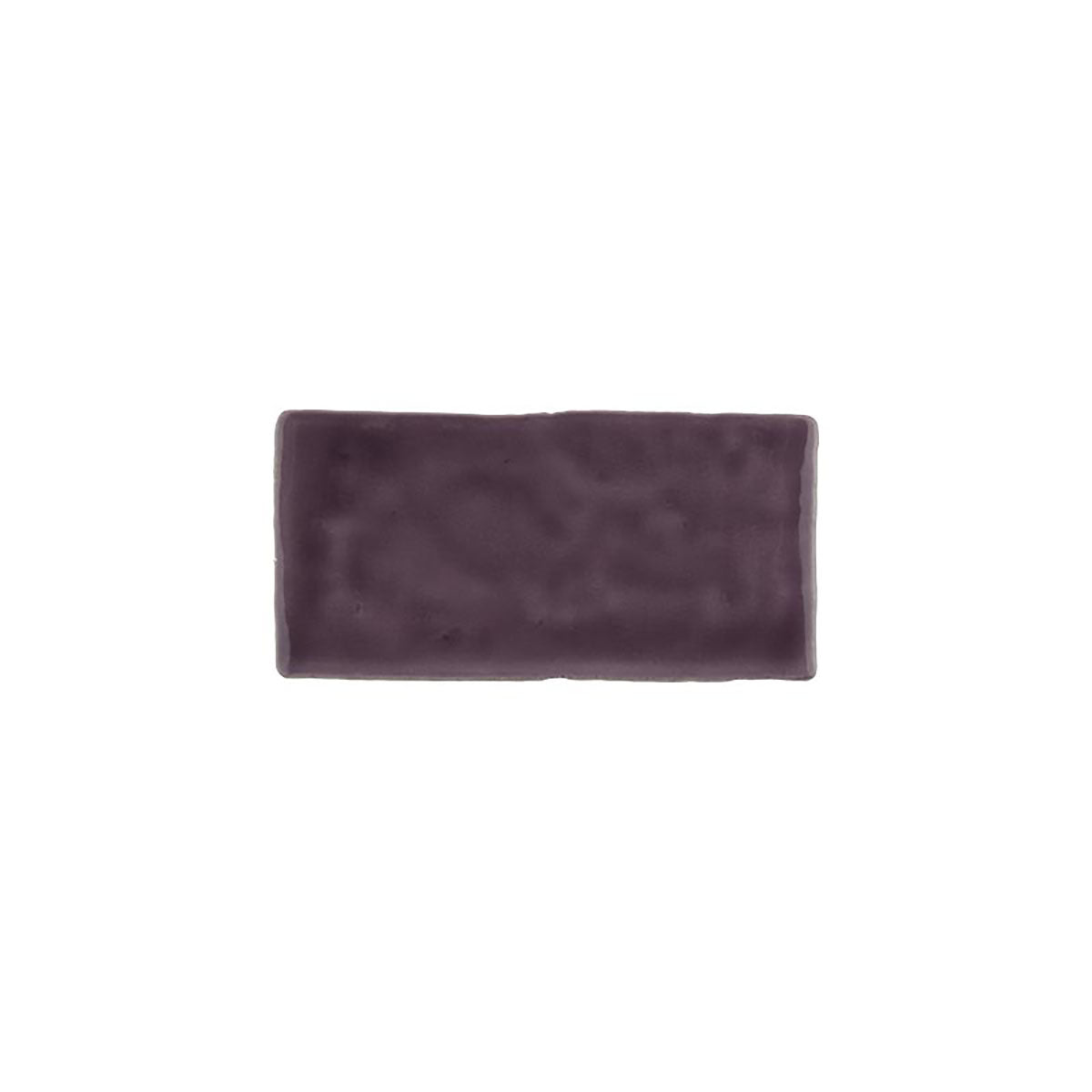 Glossy bordeaux ceramic subway tile with handcrafted Spanish artisan appeal