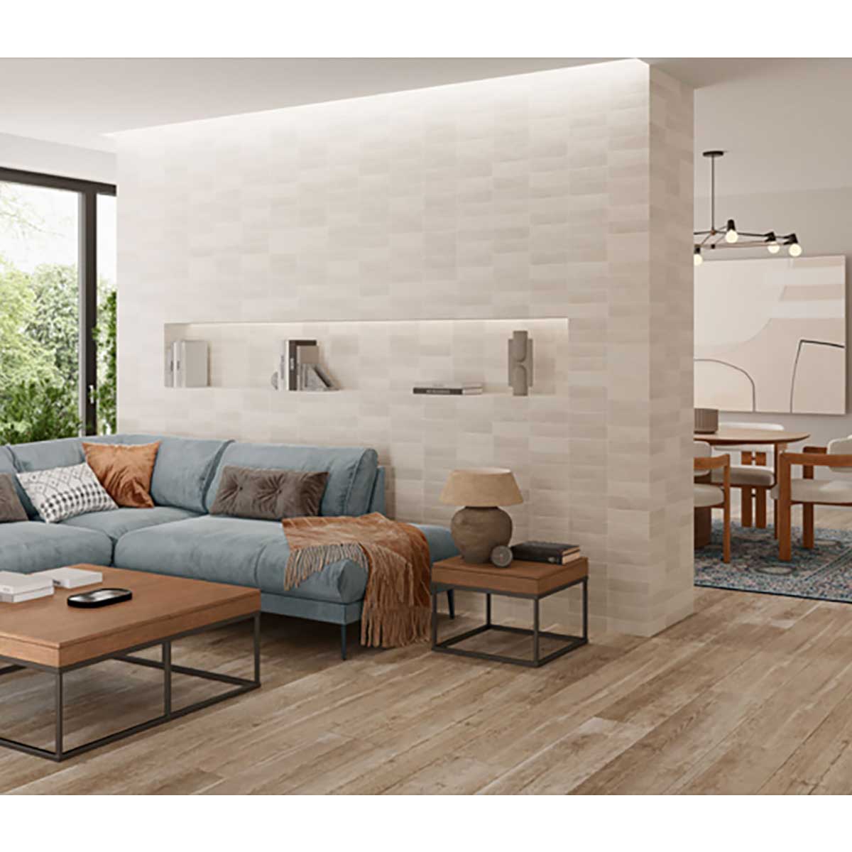 Modern living room with a sectional sofa, coffee table, and decorative items with Crema 2.5x8 Matte Ceramic Wall Tile