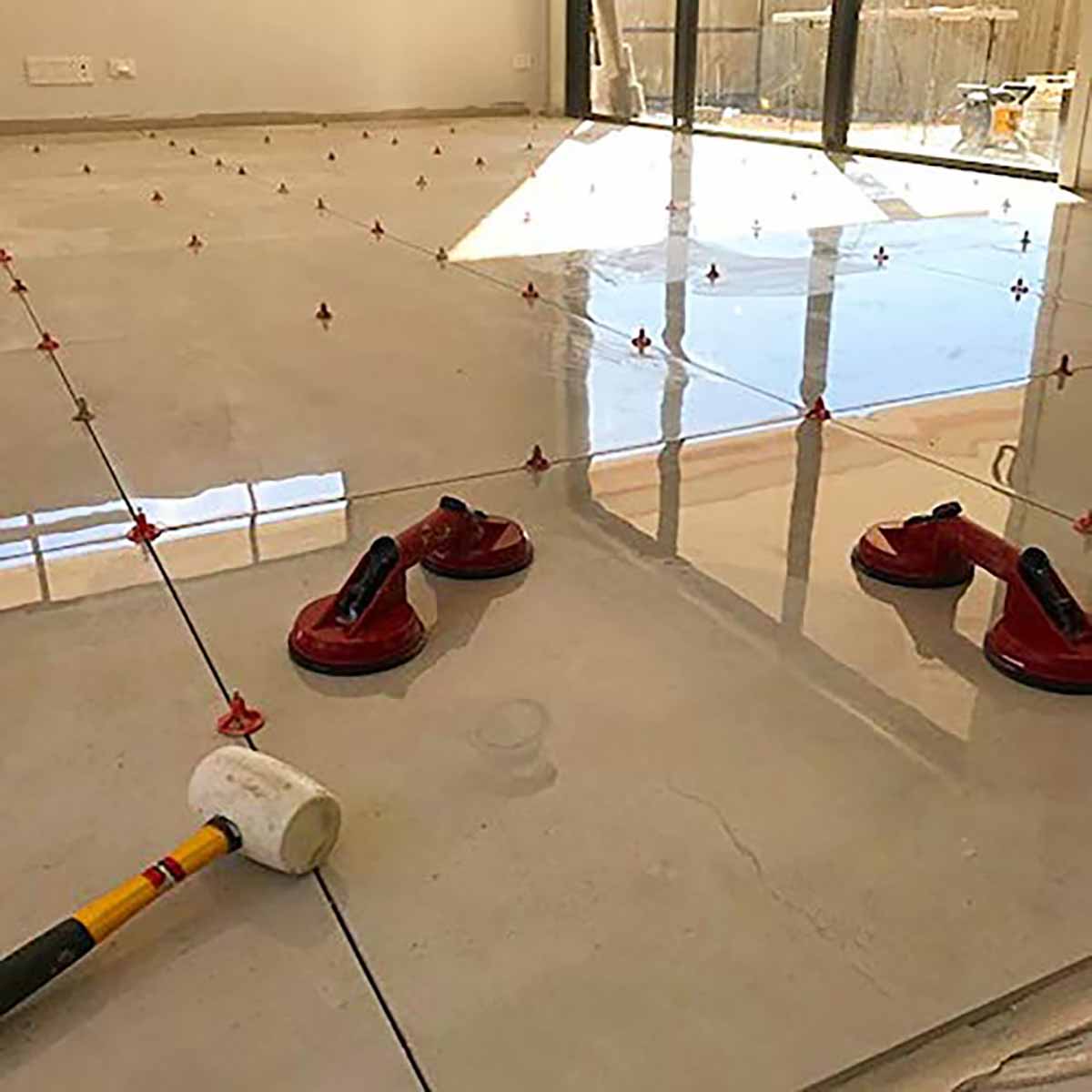 ATR Tile Leveling System use in Indoor Porcelain Tile showing the spindles attached in a Cross Pattern
