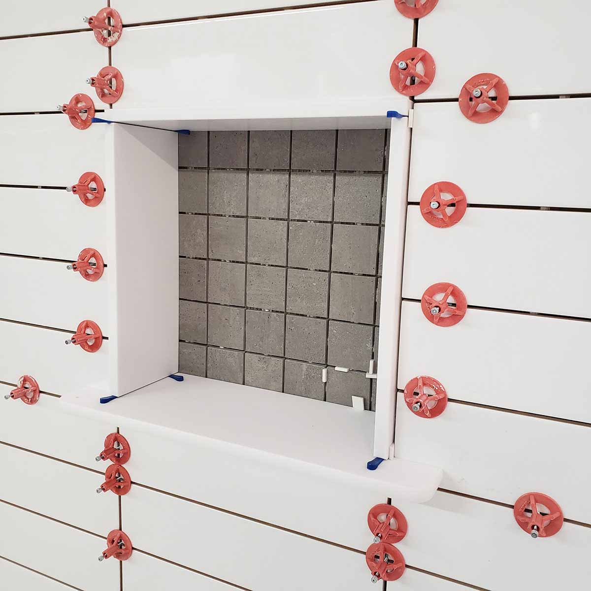 ATR Tile Leveling System use in a Shower wall showing the spindle attached in a Cross Pattern
