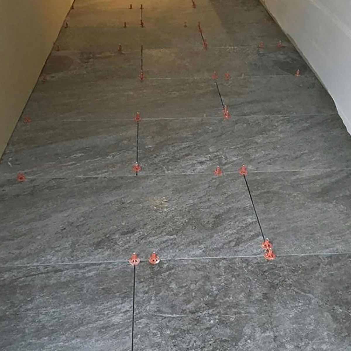 Gray tiled floor with Brick layout with Porcelain white tile with ATR Tile Leveling System T Shape Profile Spacers