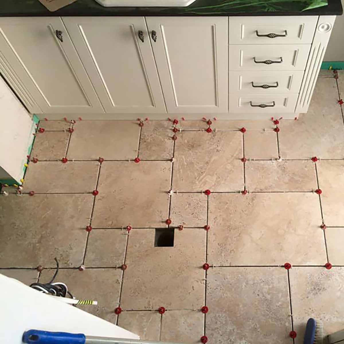 Wooden flooring with ATR Tile Leveling System T Shape Profile Spacers in a brick Pattern