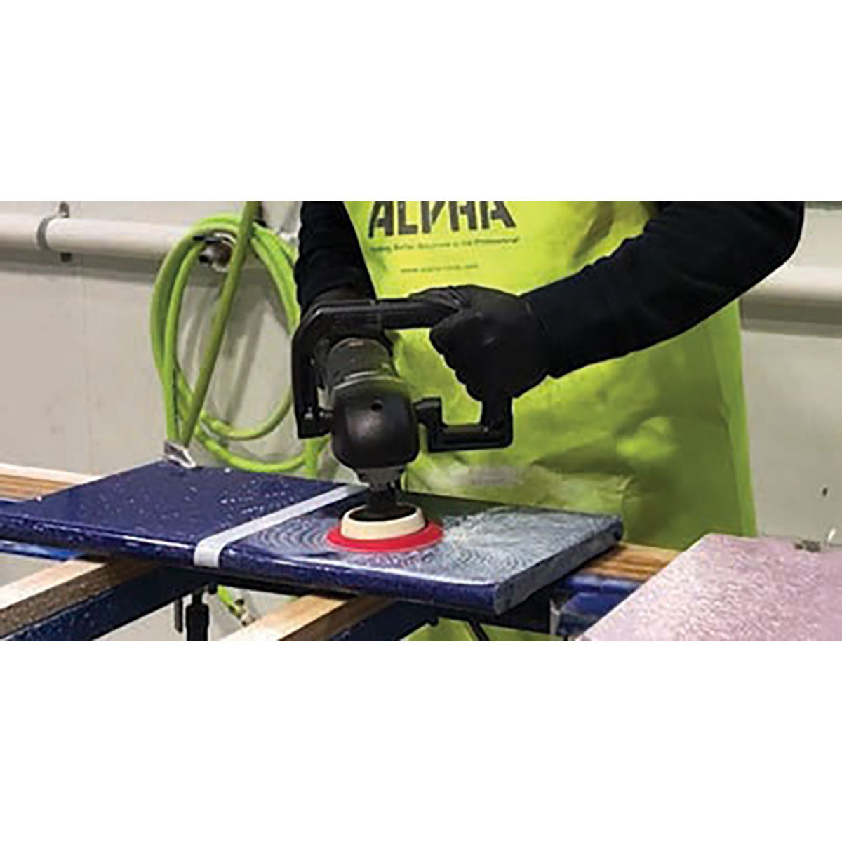 Contractor resurfacing an engineered stone countertop using the BMP Quartz Resurfacing Kit color-coded polishing system