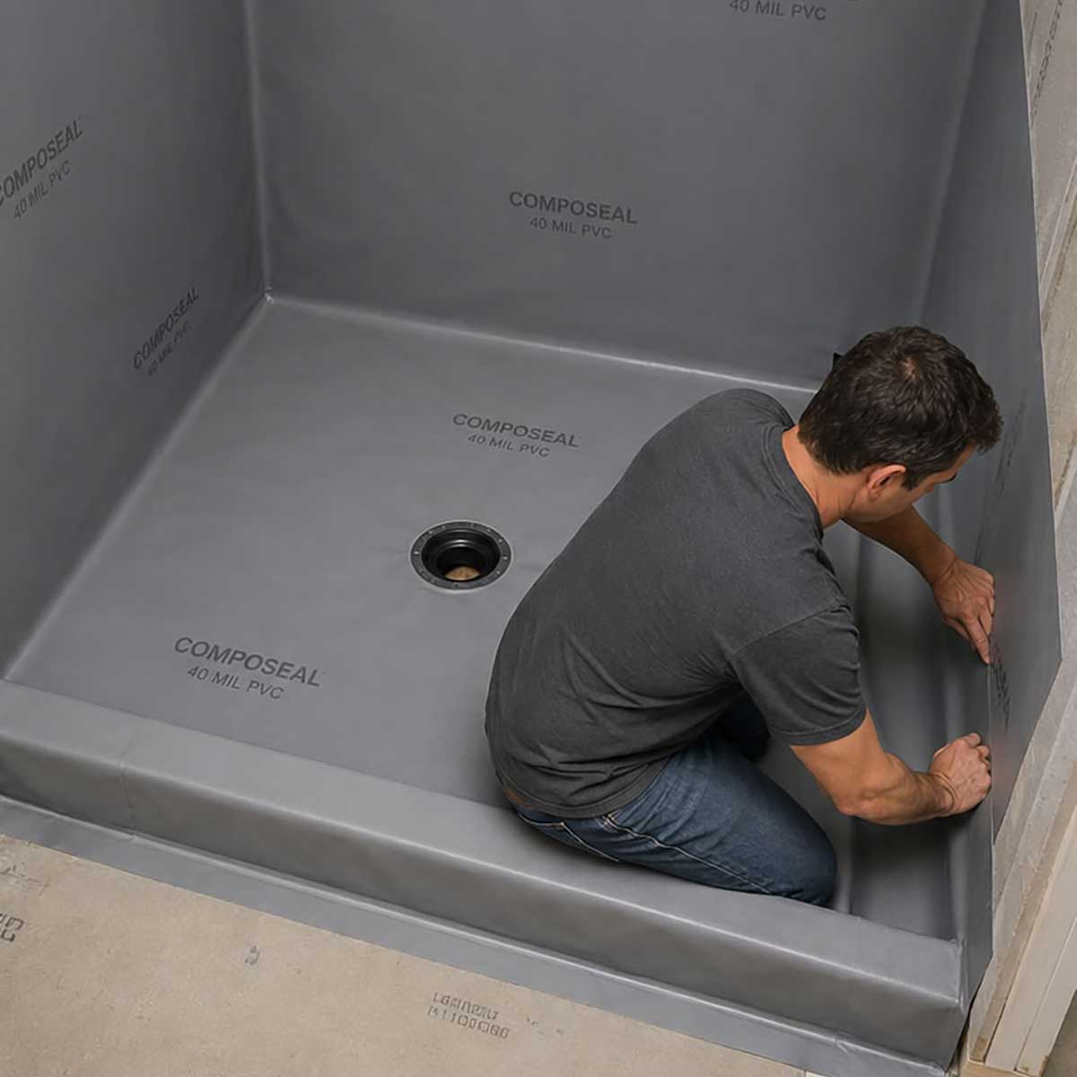 Installing Composeal 40 mil waterpoofing vinyl gray on a shower base with