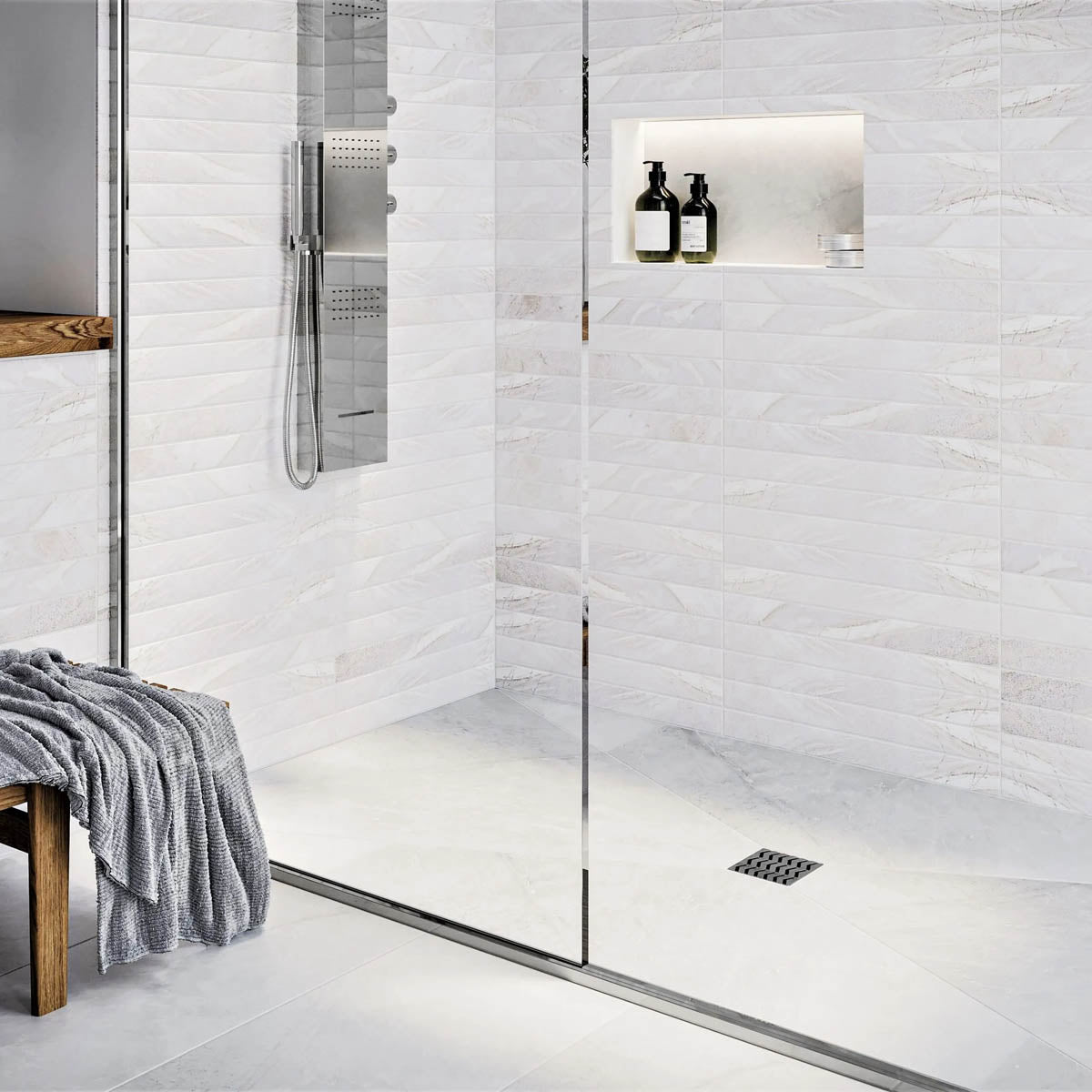 Modern bathroom with glass shower enclosure, White tiles, and gold fixtures with Ebbe Drains Unique Square Shower Drain Grate - Trend