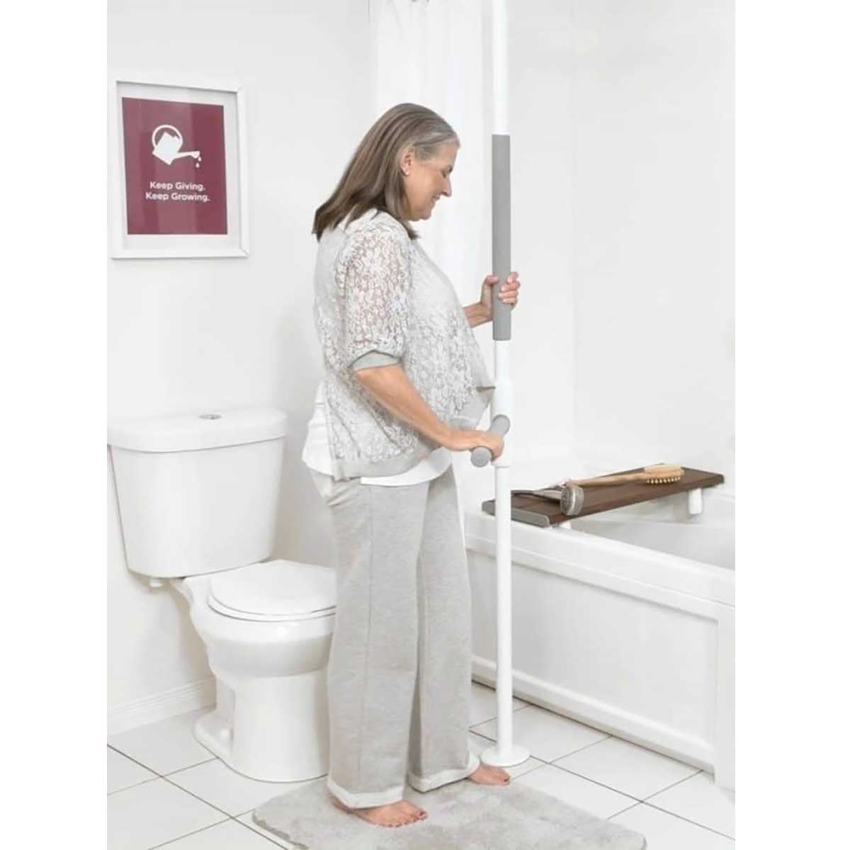 Bathroom safety support pole helping with toilet and shower transfers