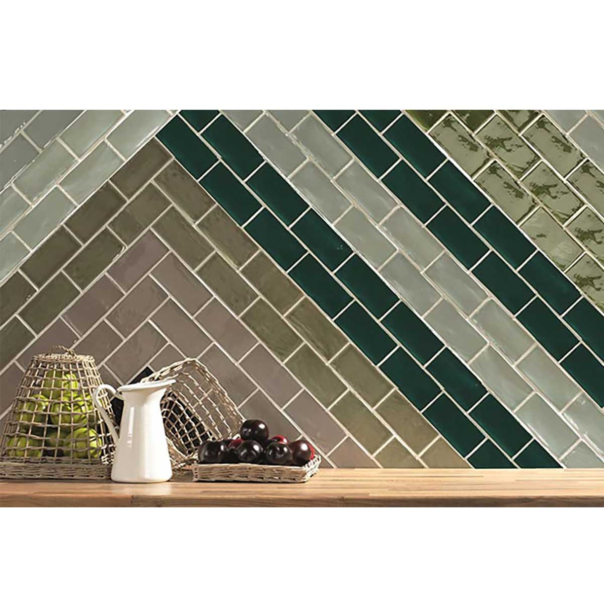 Rich green ceramic backsplash tile adding depth to a modern kitchen