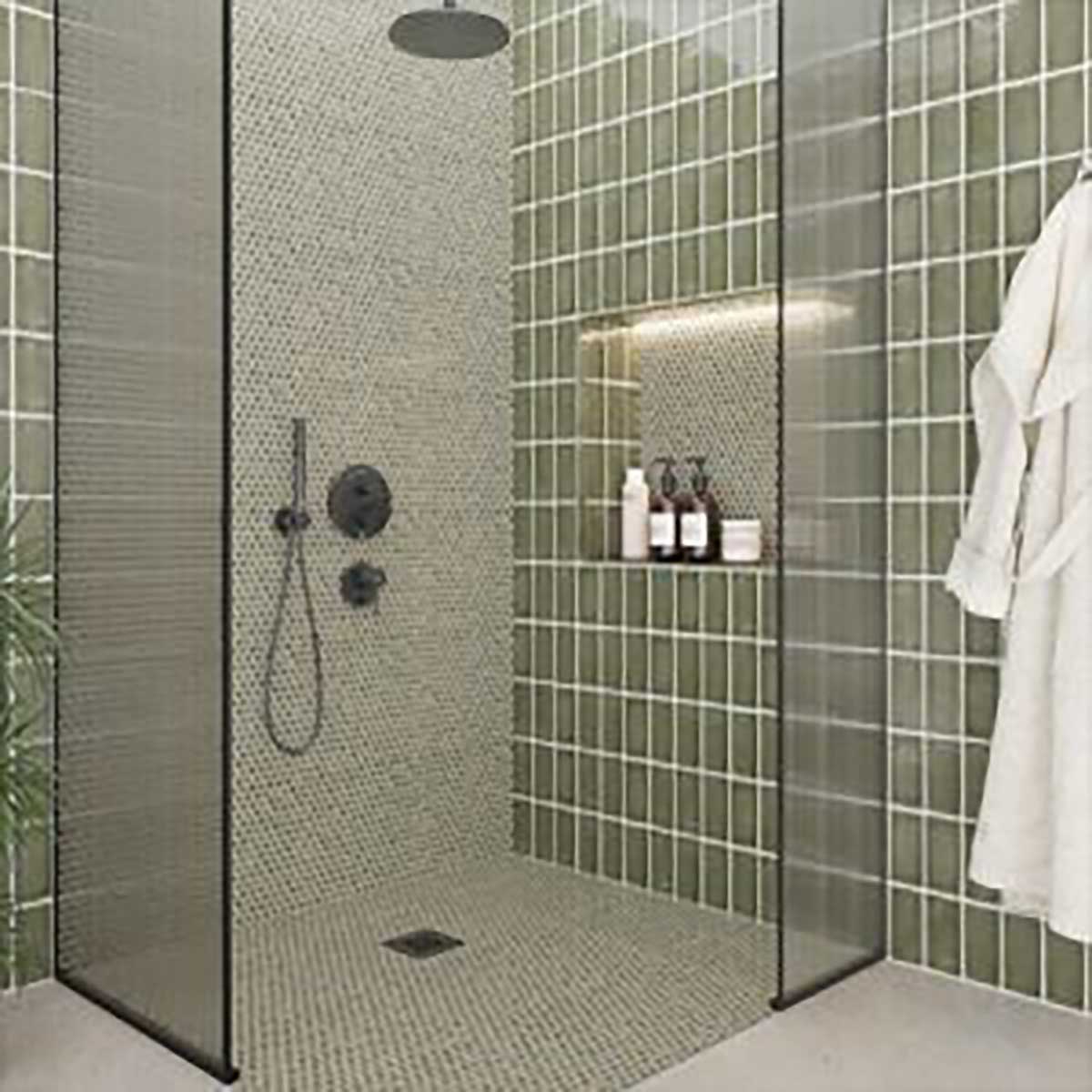 Handmade olive green wall tile creating a sophisticated feature in shower and bathroom spaces