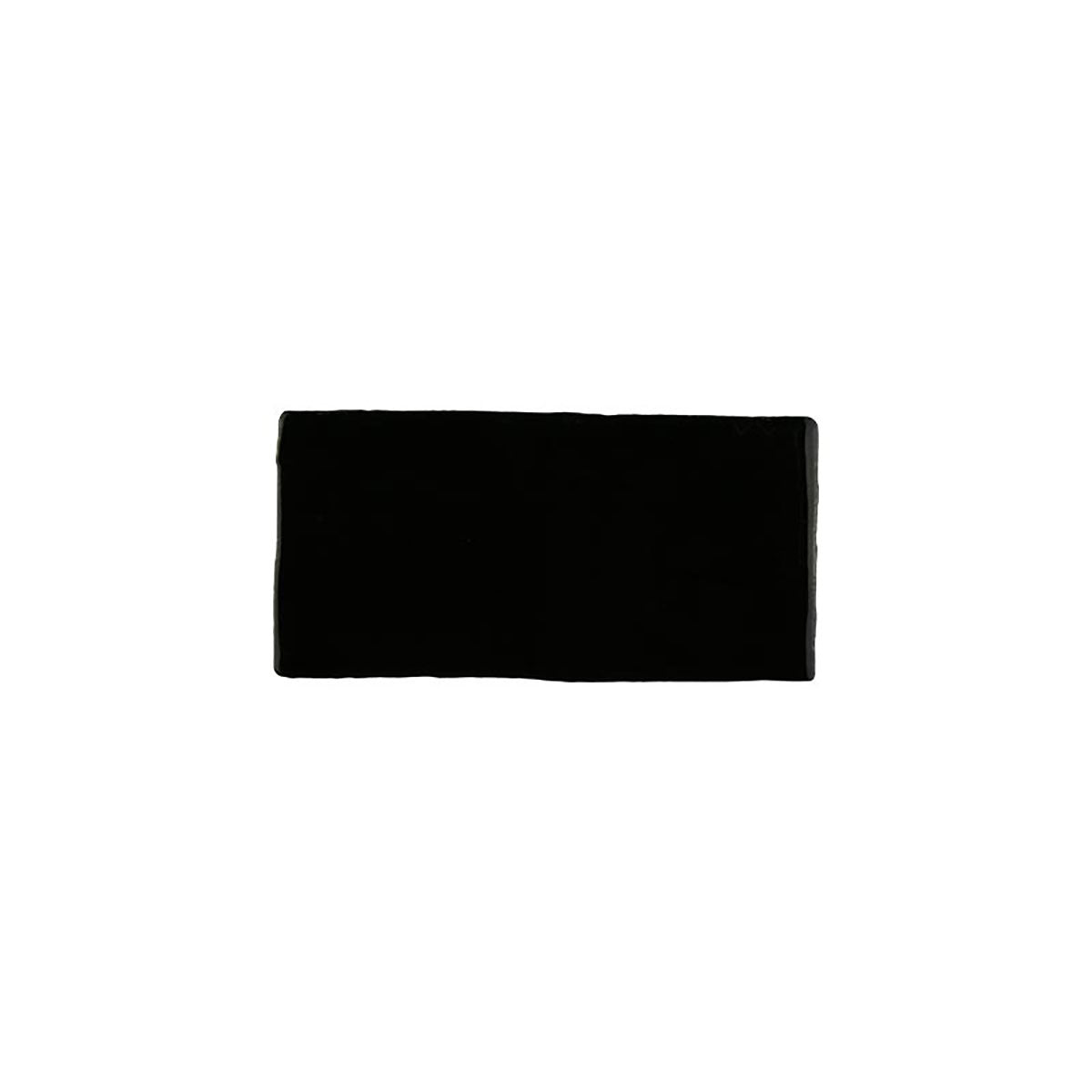 Glossy black ceramic subway tile with handcrafted Spanish artisan appeal