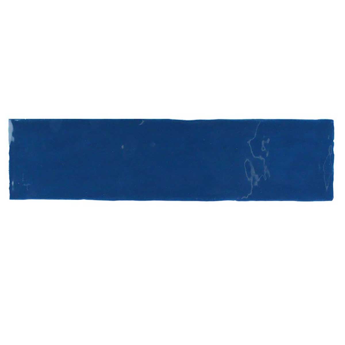 Glossy indigo ceramic subway tile with handcrafted Spanish artisan detailing