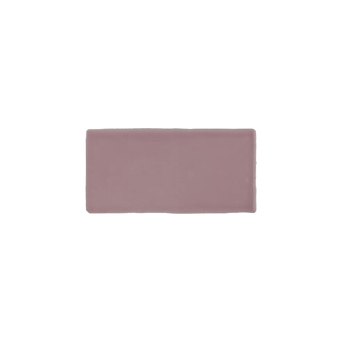 Glossy pink ceramic subway tile with handcrafted Spanish artisan detailing