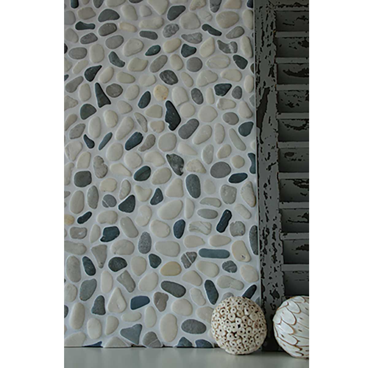 Shadow pebble mosaic shower floor creating a luxury spa inspired retreat