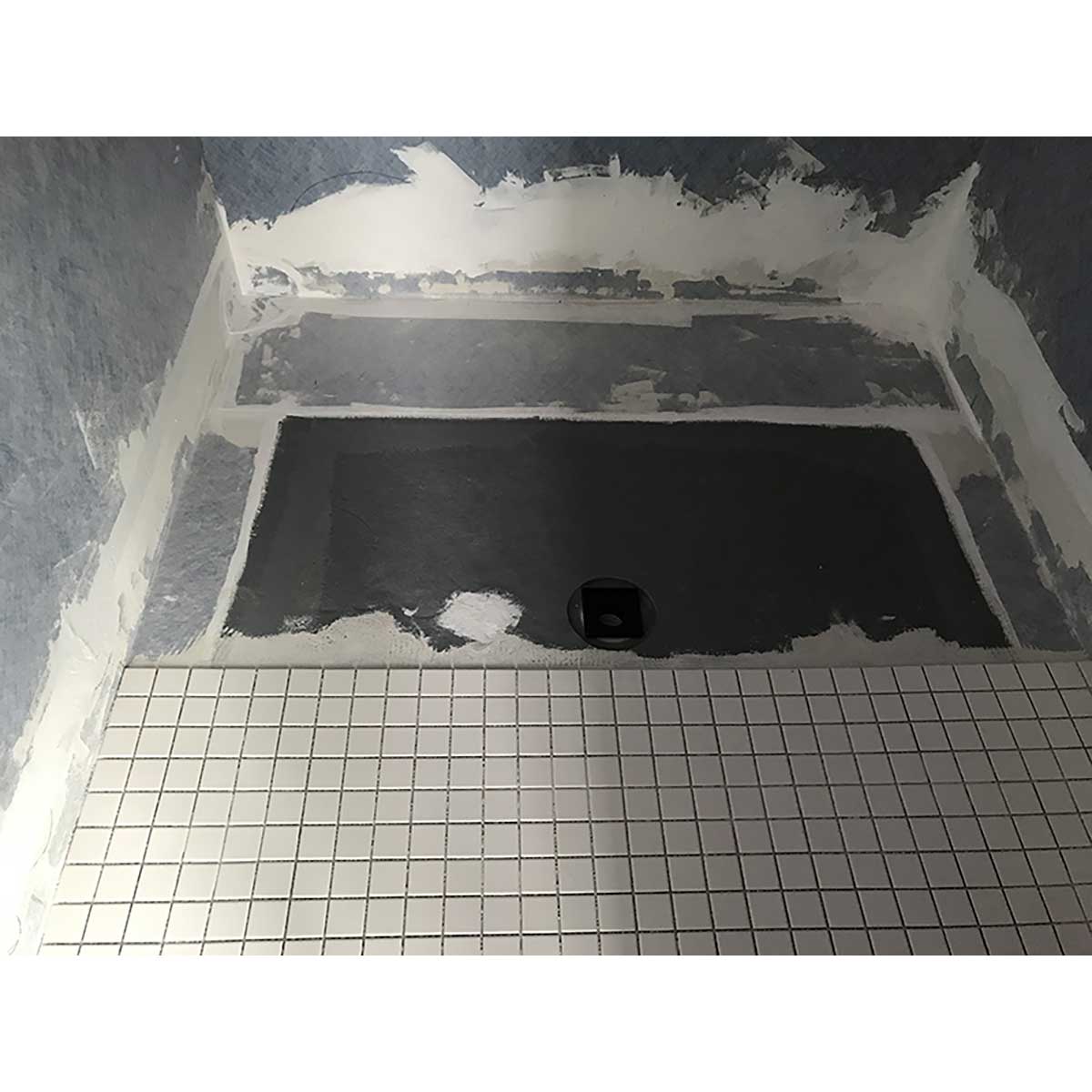 Applying sealant to waterproof shower system joints and seams