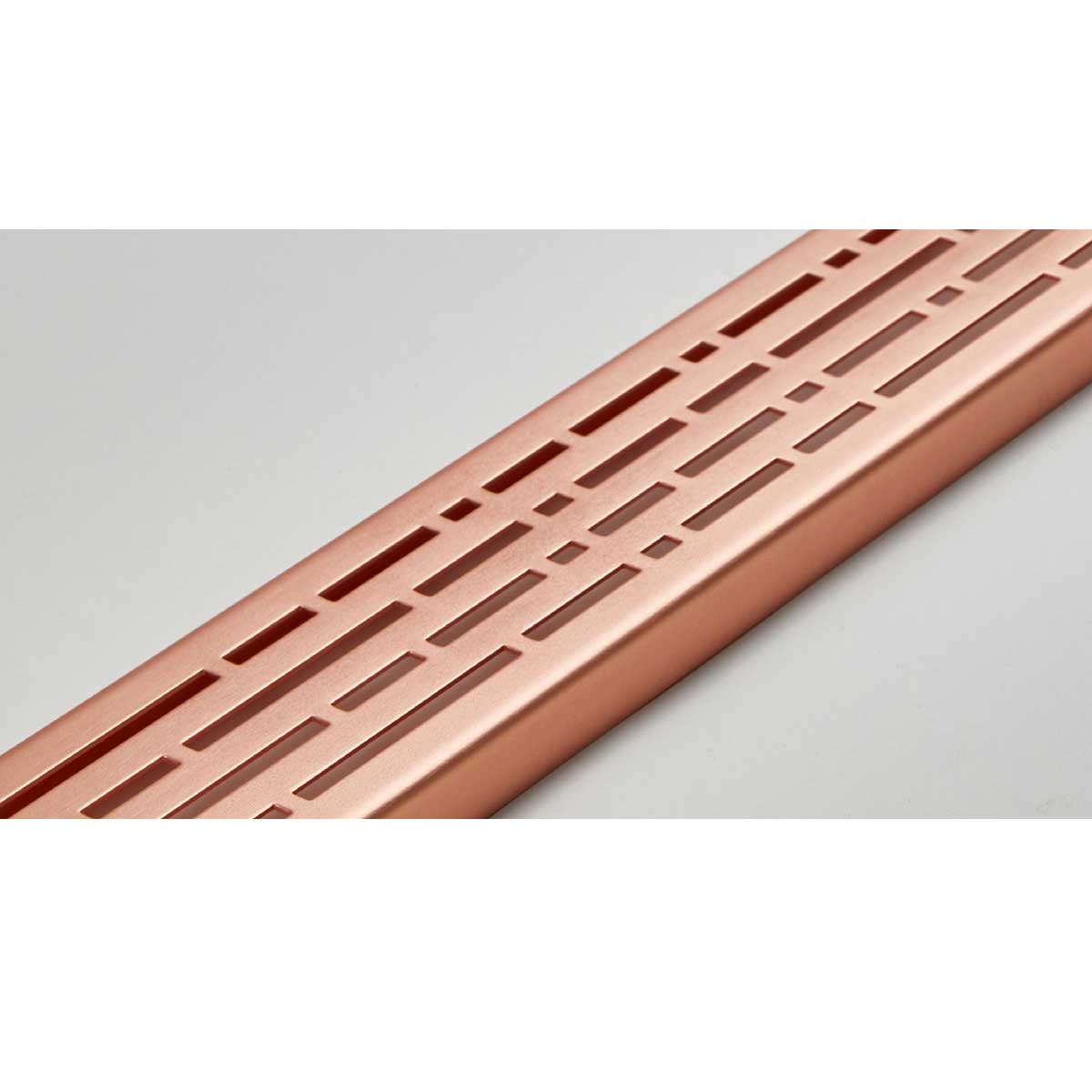 Quartz by ACO Rose Gold linear shower drain installed in contemporary curbless shower