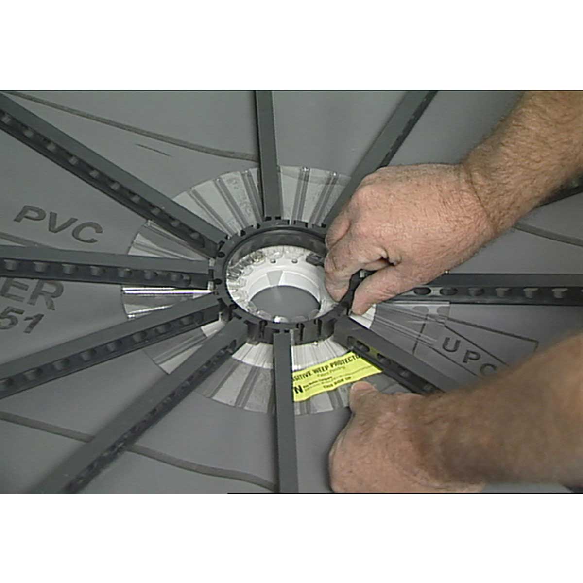 Person adjusting the quick pitch system over the weep hole protector