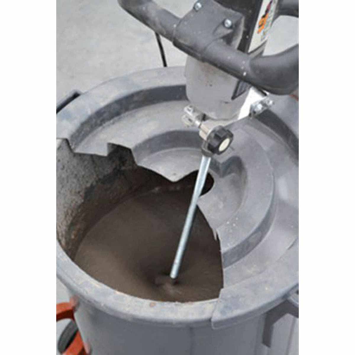 Raimondi Fluid Mixer With Paddle - MXFMS Concrete mixer with a bucket of wet concrete