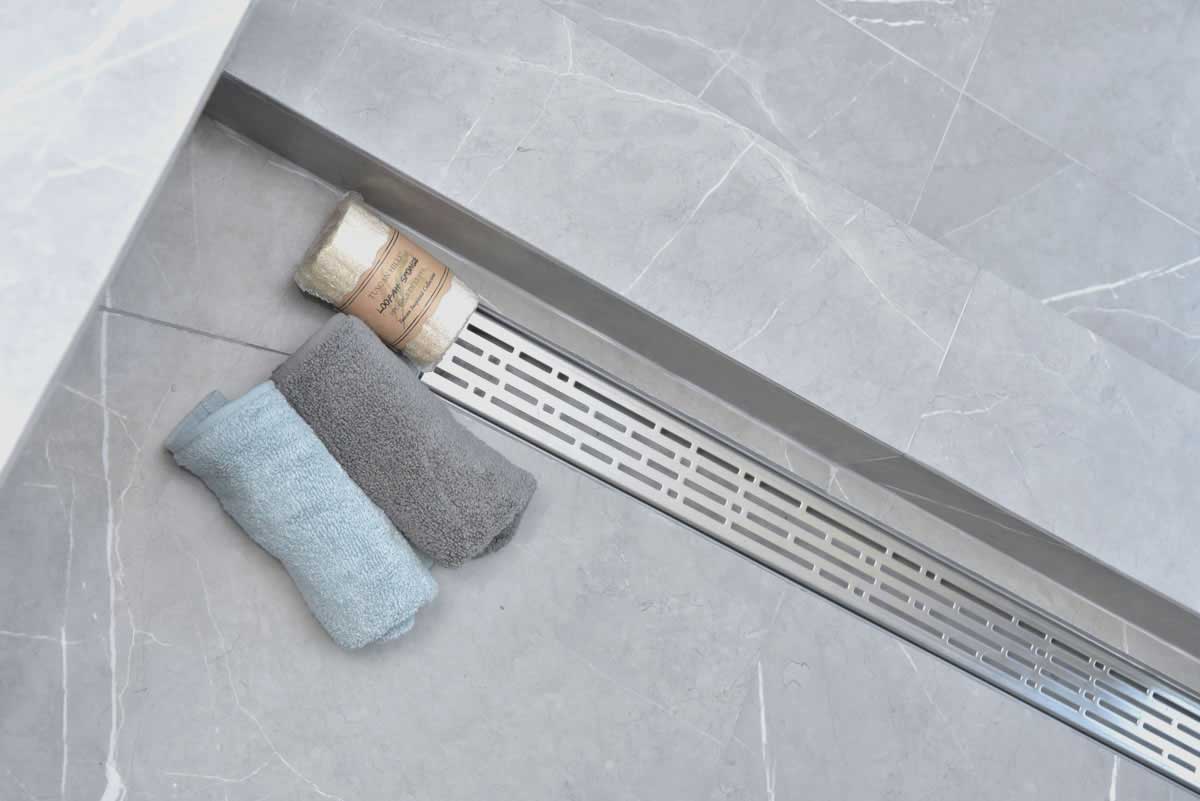 SereneDrains Wow Drain TM Side Discharge Outlet with Linear Shower Drain Horizontal Low Profile