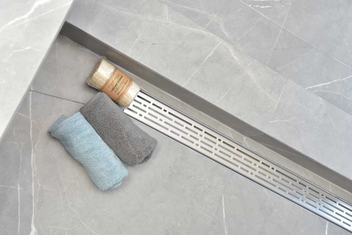 SereneDrains Wow Drain TM Side Discharge Outlet with Linear Shower Drain Horizontal Low Profile