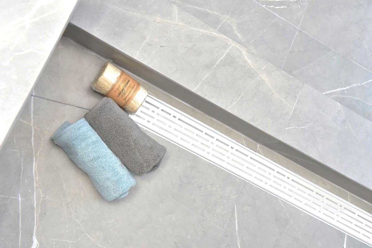 SereneDrains Wow Drain TM Side Discharge Outlet with Linear Shower Drain Horizontal Low Profile