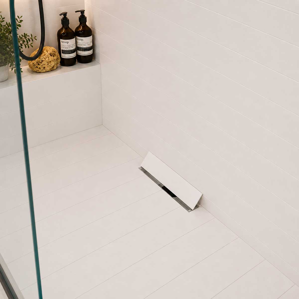 Seamless shower floor with invisible tile insert drain