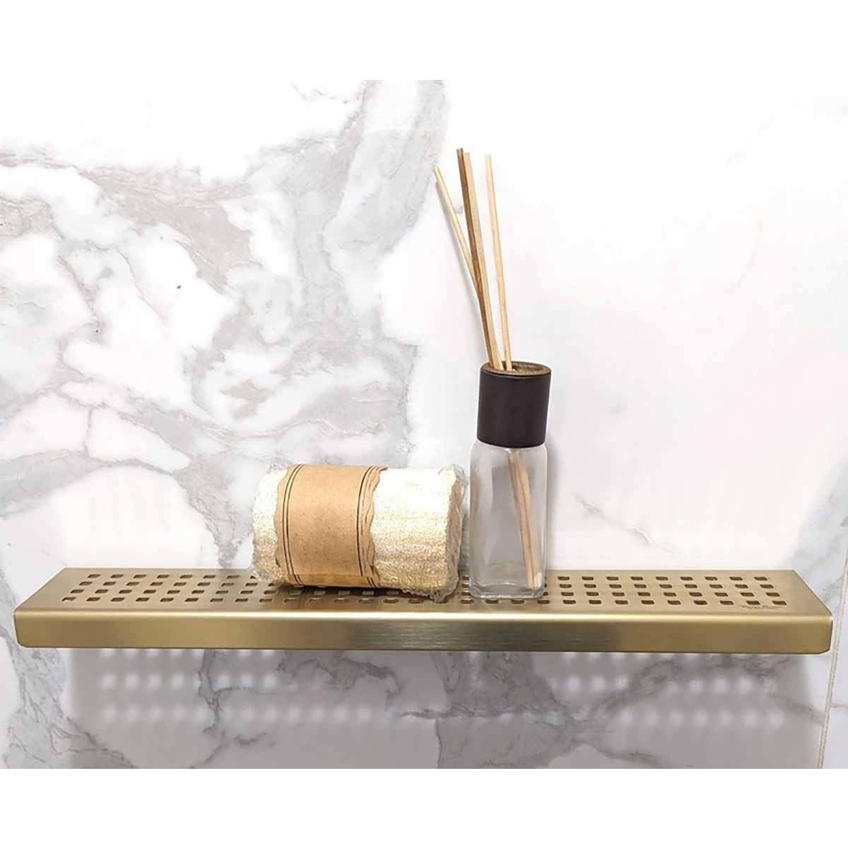 Serene Rectangle stainless steel Satin Gold shower shelf styled in a luxury marble shower