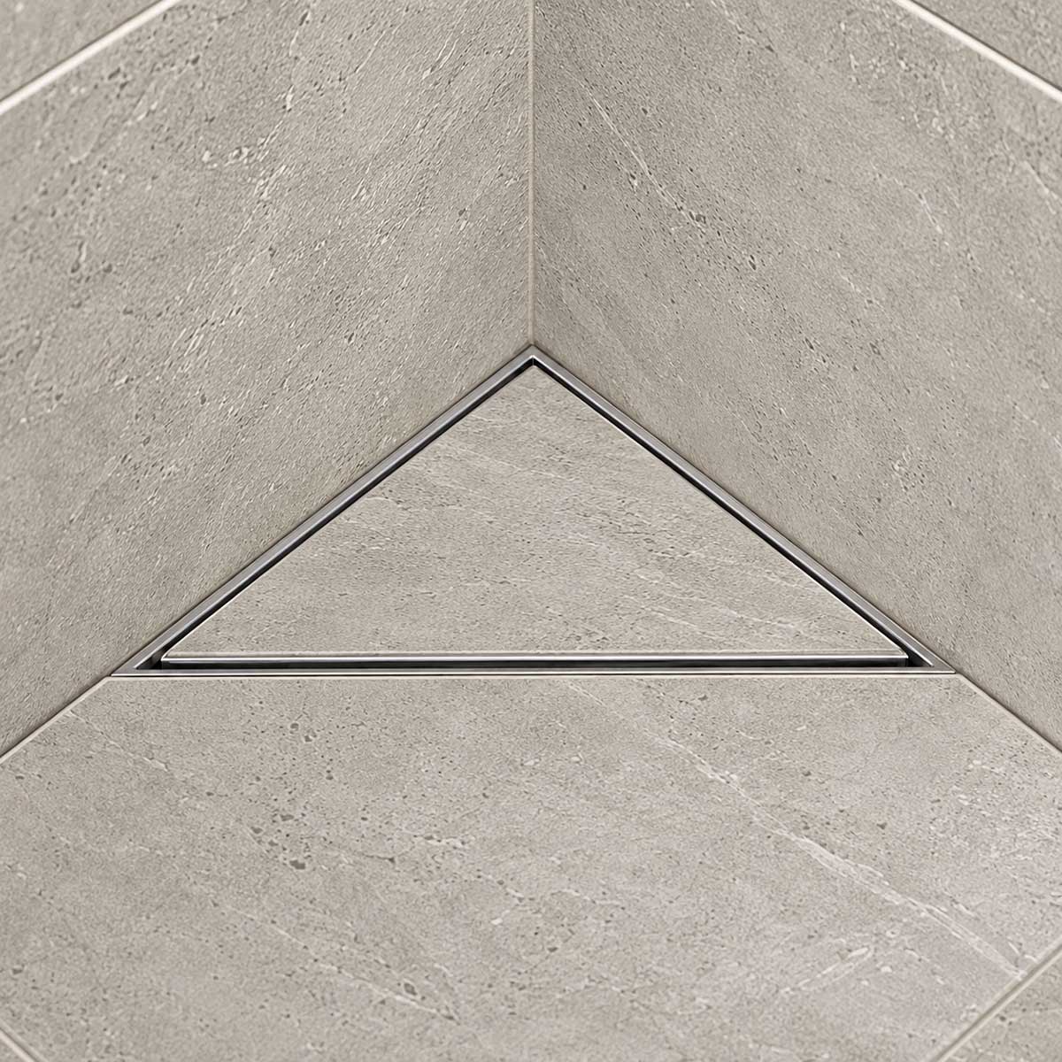 Triangle stainless steel shower floor drain installed in a modern tiled shower