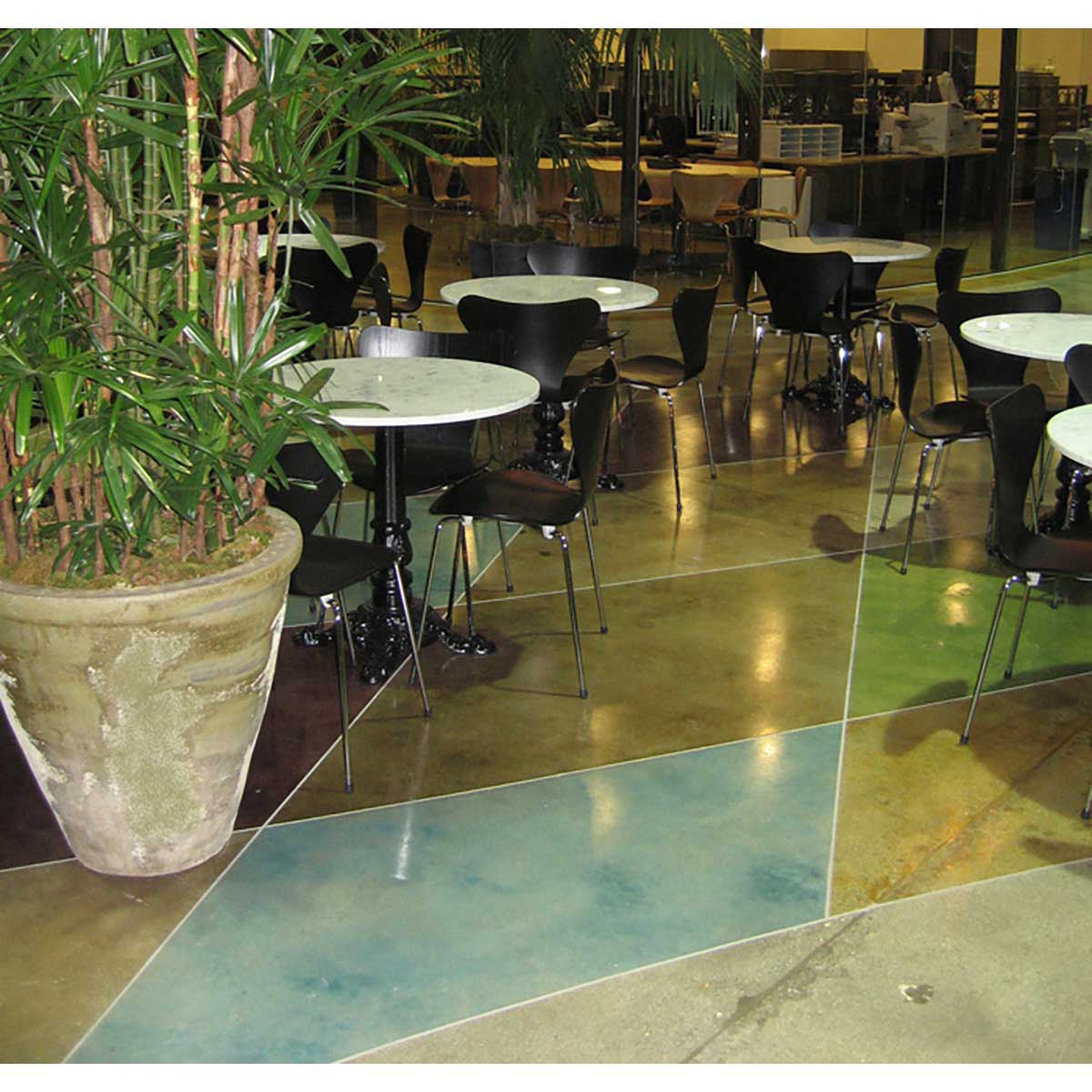 Smiths Paint Concrete Color Stains on a reflective floor.