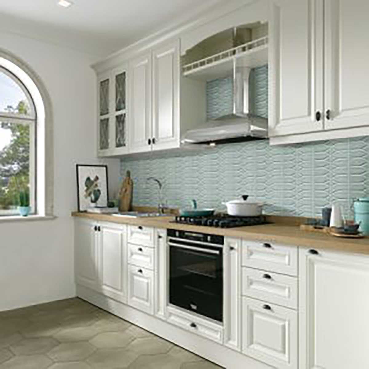 Modern kitchen with white cabinets, wooden countertops, and Takao Blue Beech 3x6 3D Matte Porcelain Tile on the Wall