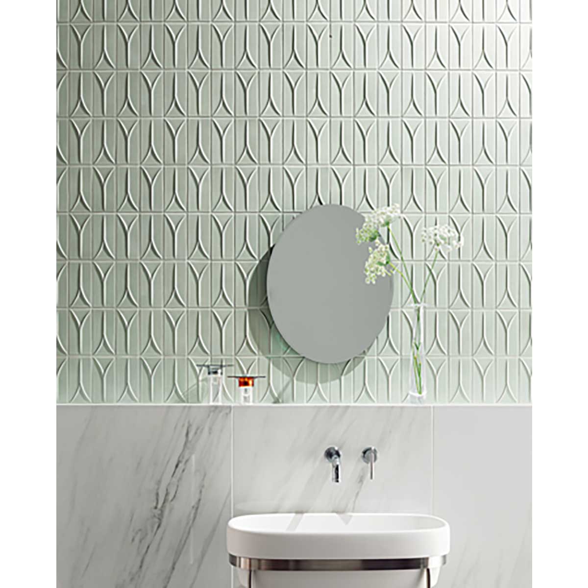 Bathroom with Takao Magnolia 3x6 3D Matte Porcelain Wall Tile and a round mirror.