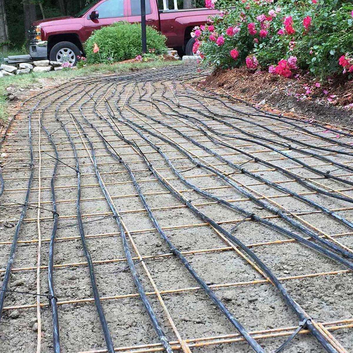 Warmup heated driveway cable layout for asphalt surfaces