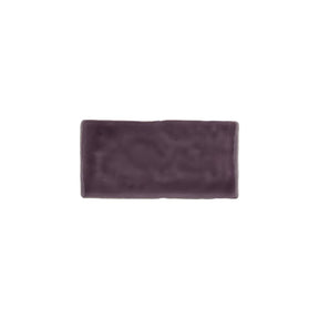 Glossy bordeaux ceramic subway tile with handcrafted Spanish artisan appeal