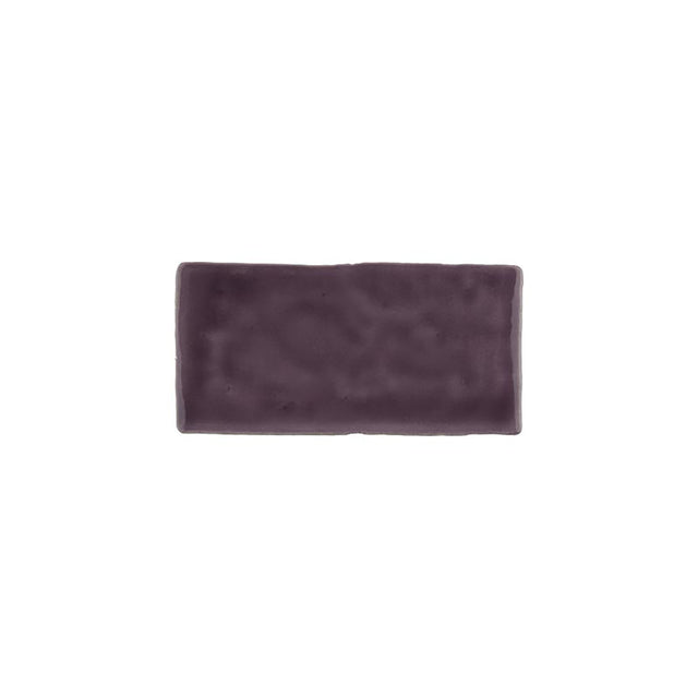 Glossy bordeaux ceramic subway tile with handcrafted Spanish artisan appeal