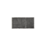 Glossy dark grey ceramic subway tile with handcrafted Spanish artisan texture