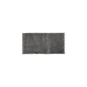 Glossy dark grey ceramic subway tile with handcrafted Spanish artisan texture