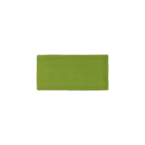Glossy cream ceramic subway tile with handcrafted Spanish artisan detailing