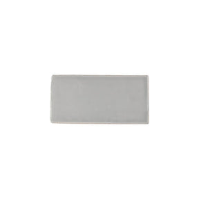 Glossy grey ceramic subway tile with handcrafted Spanish artisan detailing