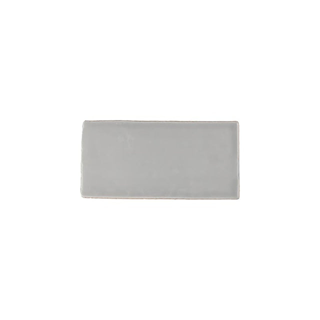 Glossy grey ceramic subway tile with handcrafted Spanish artisan detailing