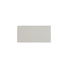 Glossy indigo ceramic bullnose trim tile with handcrafted Spanish artisan detailing