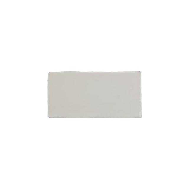 Glossy indigo ceramic bullnose trim tile with handcrafted Spanish artisan detailing