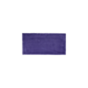 Glossy purple ceramic subway tile with handcrafted Spanish artisan detailing