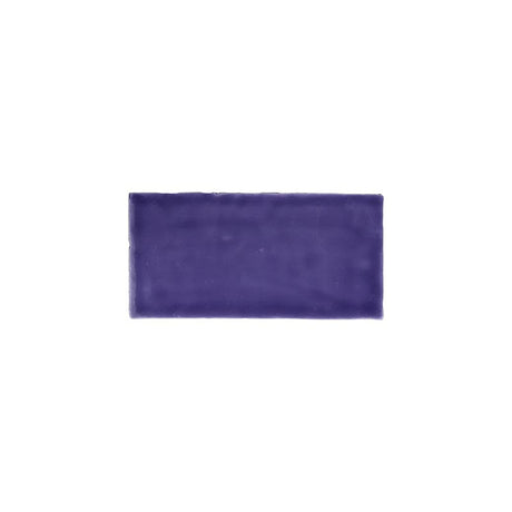 Glossy purple ceramic subway tile with handcrafted Spanish artisan detailing