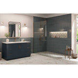 Modern bathroom with dark blue tiles and and Alhambra Series Layla 8x8 Deco Porcelain Tile, a vanity, and shower area.