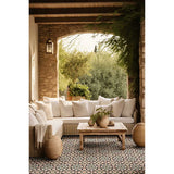 Outdoor patio with a sectional sofa, coffee table, and and Alhambra Series Layla 8x8 Deco Porcelain Tile