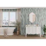 Bathroom with white freestanding bathtub, vanity, and Lago 2.5x8 Matte Ceramic Wall Tile