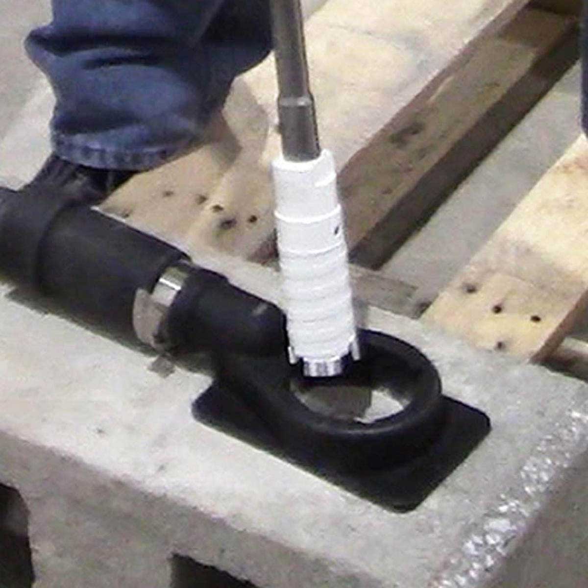Alpha Professional Tools laser segmented diamond core bit drilling into a brick wall