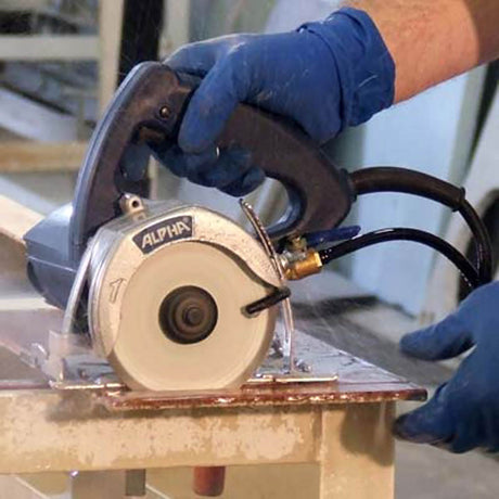 Wet stone cutting saw for granite, porcelain tile, concrete, and masonry applications