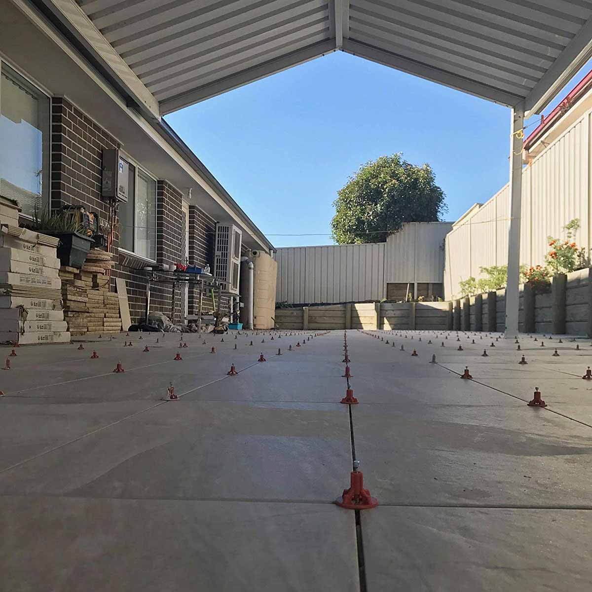 ATR Tile Leveling System use in outdoor Porcelain Tile showing the spindle attached in a Cross Pattern