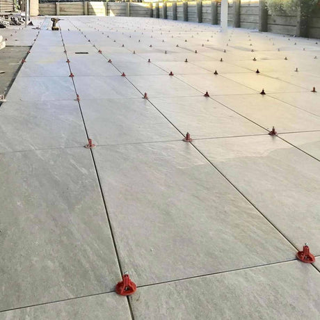 ATR Tile Leveling System use in outdoor Porcelain Tile showing the spindle attached in a Cross Pattern