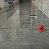 ATR Tile Leveling System use in Indoor Gray Porcelain Tile showing the spindle attached in a Cross Pattern