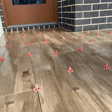 Wooden flooring with ATR Tile Leveling System T Shape Profile Spacers in a brick Pattern 